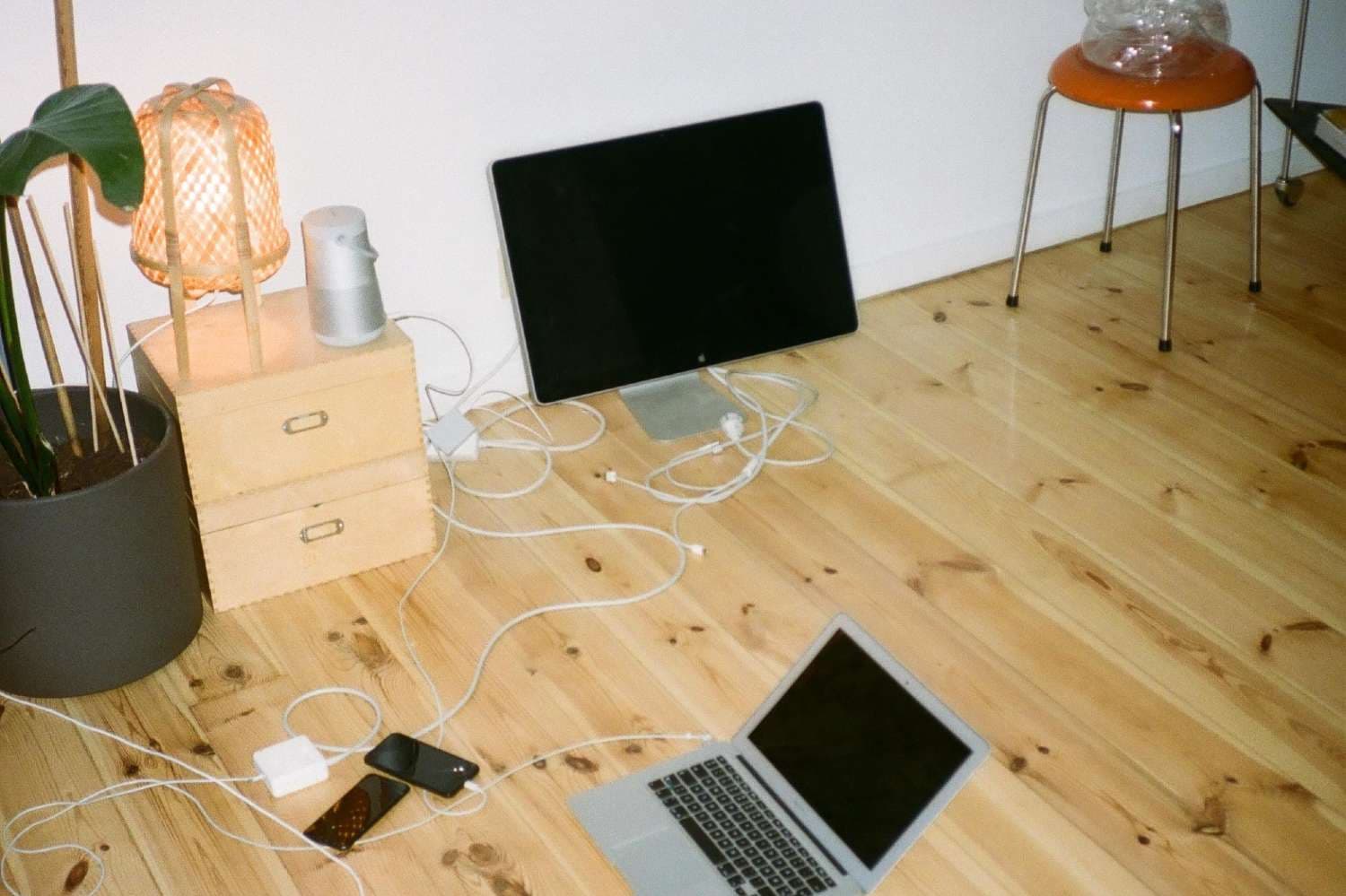 Electronics on the floor in a student apartment.